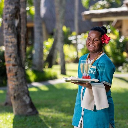 Outrigger Fiji Beach Resort Korotogo Exterior photo A hotel staff in Mauritius