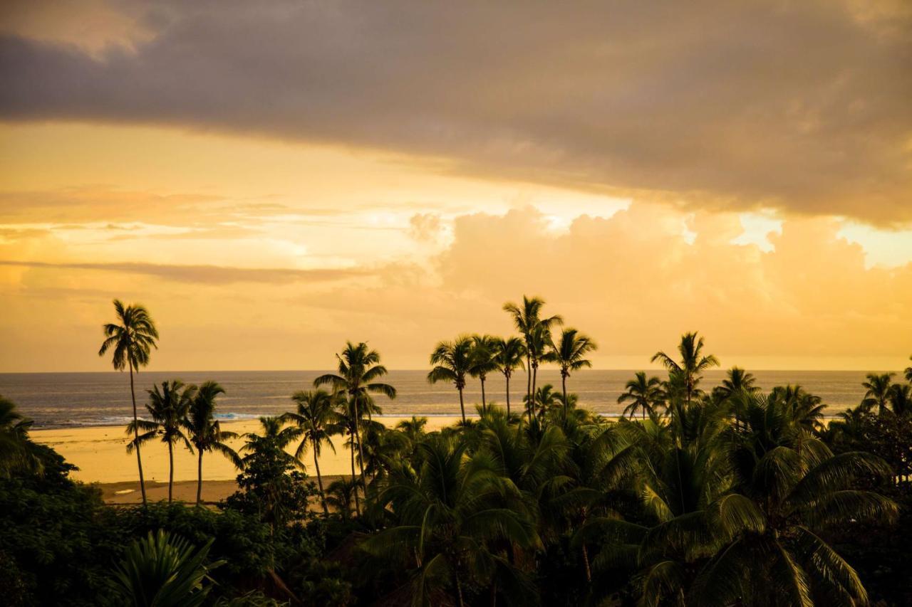Outrigger Fiji Beach Resort Korotogo Exterior photo Sunset at the beach