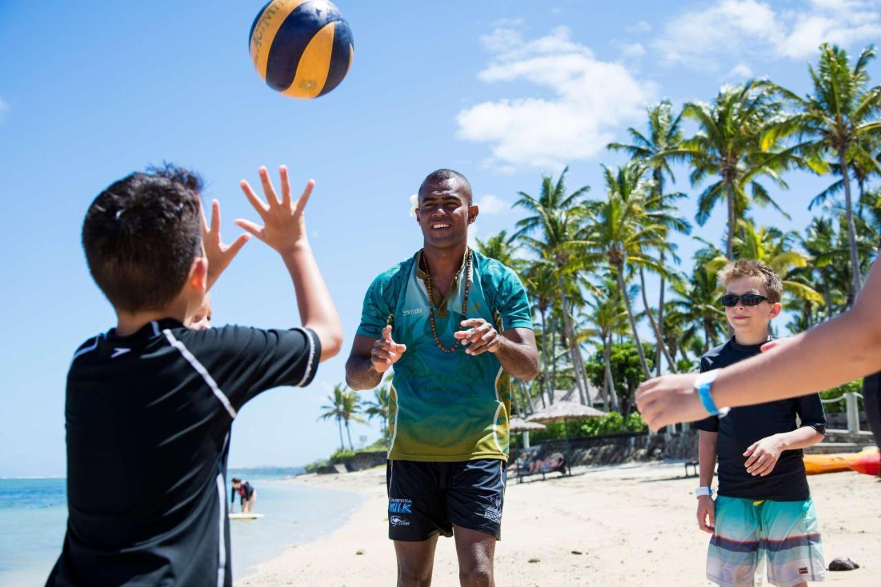 Outrigger Fiji Beach Resort Korotogo Exterior photo Children playing beach volleyball