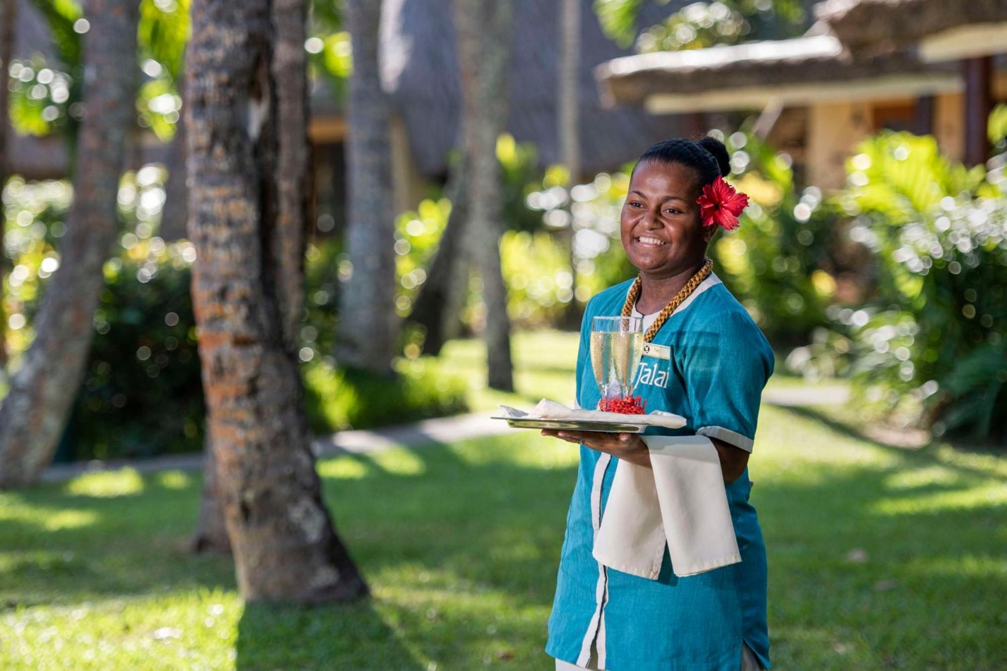 Outrigger Fiji Beach Resort Korotogo Exterior photo A hotel staff in Mauritius